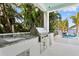 Outdoor kitchen equipped with a modern stainless steel grill, granite counters, and a sink at 105 Cordova Ne Blvd, St Petersburg, FL 33704