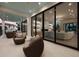 Inviting covered patio showcasing comfortable seating and views of the elegantly designed living room at 105 Cordova Ne Blvd, St Petersburg, FL 33704