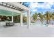 A covered outdoor dining area offers a beautiful view of the pool and waterfront at 105 Cordova Ne Blvd, St Petersburg, FL 33704