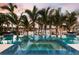 Beautiful pool and spa featuring tropical landscaping and a waterfront view at 105 Cordova Ne Blvd, St Petersburg, FL 33704