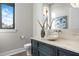 Chic powder room featuring a vessel sink, custom vanity, marble countertop, and designer lighting at 105 Cordova Ne Blvd, St Petersburg, FL 33704