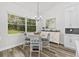 Bright breakfast nook with white cabinetry and a round table at 4586 Hickory Oak Dr, Brooksville, FL 34601