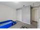 Neutral bedroom with a cute car-shaped bed, white closet doors, and soft carpet at 5325 Bradbury Ct, Tampa, FL 33624