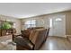 Inviting living room showcasing wood-look floors, neutral paint, and a comfortable sofa at 5325 Bradbury Ct, Tampa, FL 33624