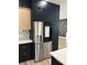 Stainless steel refrigerator with water and ice dispenser in modern kitchen at 1004 E Sligh Ave, Tampa, FL 33604