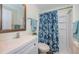 Clean bathroom with shower, toilet and vanity at 3455 Countryside Blvd # 52, Clearwater, FL 33761