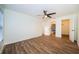 Bedroom with ceiling fan and access to bathroom and closet at 3455 Countryside Blvd # 52, Clearwater, FL 33761