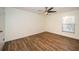 Bedroom with ceiling fan and wood-look floors at 3455 Countryside Blvd # 52, Clearwater, FL 33761
