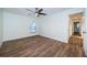 Spacious bedroom with ceiling fan and access to bathroom at 3455 Countryside Blvd # 52, Clearwater, FL 33761