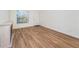Living room featuring wood-look floors and natural light at 3455 Countryside Blvd # 52, Clearwater, FL 33761