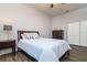 A bedroom features a bed, dresser, closet, ceiling fan and a large window at 3604 W Paxton Ave, Tampa, FL 33611