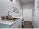 This spacious laundry room features ample storage and a utility sink at 3604 W Paxton Ave, Tampa, FL 33611