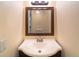 Bathroom with a vanity, sink, and framed mirror at 4883 W Mcelroy Ave # G211, Tampa, FL 33611