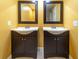 Double vanity bathroom with dark cabinets at 4883 W Mcelroy Ave # G211, Tampa, FL 33611