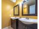 Double vanity bathroom with dark cabinets at 4883 W Mcelroy Ave # G211, Tampa, FL 33611