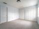 Large bedroom with carpet and double closets at 4883 W Mcelroy Ave # G211, Tampa, FL 33611