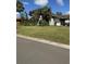 Front lawn view showcasing the home's landscaping, driveway, and exterior at 5143 Vassar Ln, Sarasota, FL 34243