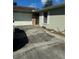 Exterior view of a single-story home featuring a driveway and attached garage at 5143 Vassar Ln, Sarasota, FL 34243