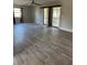 Living room filled with natural light and wood-look flooring at 5143 Vassar Ln, Sarasota, FL 34243