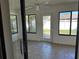 Sunroom with tile flooring and backyard access at 5143 Vassar Ln, Sarasota, FL 34243