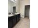 Bathroom with double vanity and walk-in shower at 8219 Caponata Blvd, Seminole, FL 33777