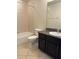 Clean bathroom, featuring a bathtub, toilet, and dark brown vanity at 8219 Caponata Blvd, Seminole, FL 33777