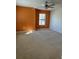 Bright bedroom with orange accent wall and ceiling fan at 8219 Caponata Blvd, Seminole, FL 33777