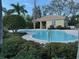 Community pool with covered seating area at 8219 Caponata Blvd, Seminole, FL 33777