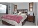 Main bedroom with a plush bed and wood furniture at 117 114Th N Ave # 117, St Petersburg, FL 33716