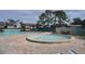 Community pool and spa with patio furniture at 117 114Th N Ave # 117, St Petersburg, FL 33716