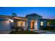 Home exterior at dusk with inviting front porch at 316 Jasmine Way, Clearwater, FL 33756