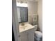 Bathroom features a vanity with storage and decorative flamingo at 2690 Coral Landings Blvd # 722, Palm Harbor, FL 34684