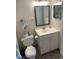 Cozy bathroom features a single sink vanity, toilet and decorative flamingo at 2690 Coral Landings Blvd # 722, Palm Harbor, FL 34684