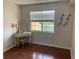 Bedroom with hardwood floors, vanity with mirror, and window at 2690 Coral Landings Blvd # 722, Palm Harbor, FL 34684