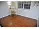 Bedroom with hardwood floors, vanity with mirror, and window at 2690 Coral Landings Blvd # 722, Palm Harbor, FL 34684