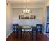 Cozy dining area featuring a round table, stools, and decorative details on the adjacent wall at 2690 Coral Landings Blvd # 722, Palm Harbor, FL 34684