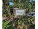 Meadowlake Palm Harbor entrance sign is surrounded by lush landscaping at 2690 Coral Landings Blvd # 722, Palm Harbor, FL 34684
