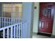 A front door with a wreath hangs and unit number is visible at 2690 Coral Landings Blvd # 722, Palm Harbor, FL 34684