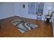 Bright living room with hardwood floors, bar stools, and a window with natural light at 2690 Coral Landings Blvd # 722, Palm Harbor, FL 34684