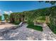Inviting outdoor patio featuring a pergola covered in lush greenery, creating a serene retreat for relaxation and enjoyment at 2690 Coral Landings Blvd # 722, Palm Harbor, FL 34684