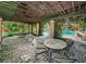 Relaxing outdoor patio with fountain, offering a peaceful escape with views of the community pool and beautifully manicured grounds at 2690 Coral Landings Blvd # 722, Palm Harbor, FL 34684