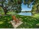 Enjoy the serene pond view from the bench in the Meadowlake community at 2690 Coral Landings Blvd # 722, Palm Harbor, FL 34684