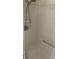 Shower stall with white tile, shower head, and grab bar at 2690 Coral Landings Blvd # 722, Palm Harbor, FL 34684