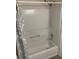 Shower over tub featuring a tub surround, shower curtain, and shower head at 2690 Coral Landings Blvd # 722, Palm Harbor, FL 34684