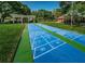 Shuffleboard court is meticulously kept and framed by lush greenery and a shaded shelter at 2690 Coral Landings Blvd # 722, Palm Harbor, FL 34684