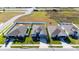 Aerial view of houses with gray roofs and white siding at 8852 Prairie Creek Dr, New Port Richey, FL 34655