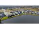 Aerial view of homes near lake in community at 8852 Prairie Creek Dr, New Port Richey, FL 34655