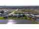 Aerial view of houses, lake, and community landscape at 8852 Prairie Creek Dr, New Port Richey, FL 34655