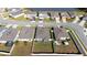 Aerial view of homes with backyard and lake at 8852 Prairie Creek Dr, New Port Richey, FL 34655
