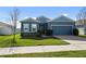 Single-story home with two-car garage and landscaped yard at 8852 Prairie Creek Dr, New Port Richey, FL 34655